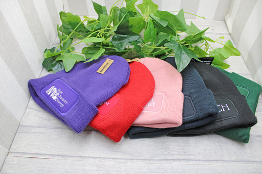 Stack of colourful beanies showing different colour options for readers