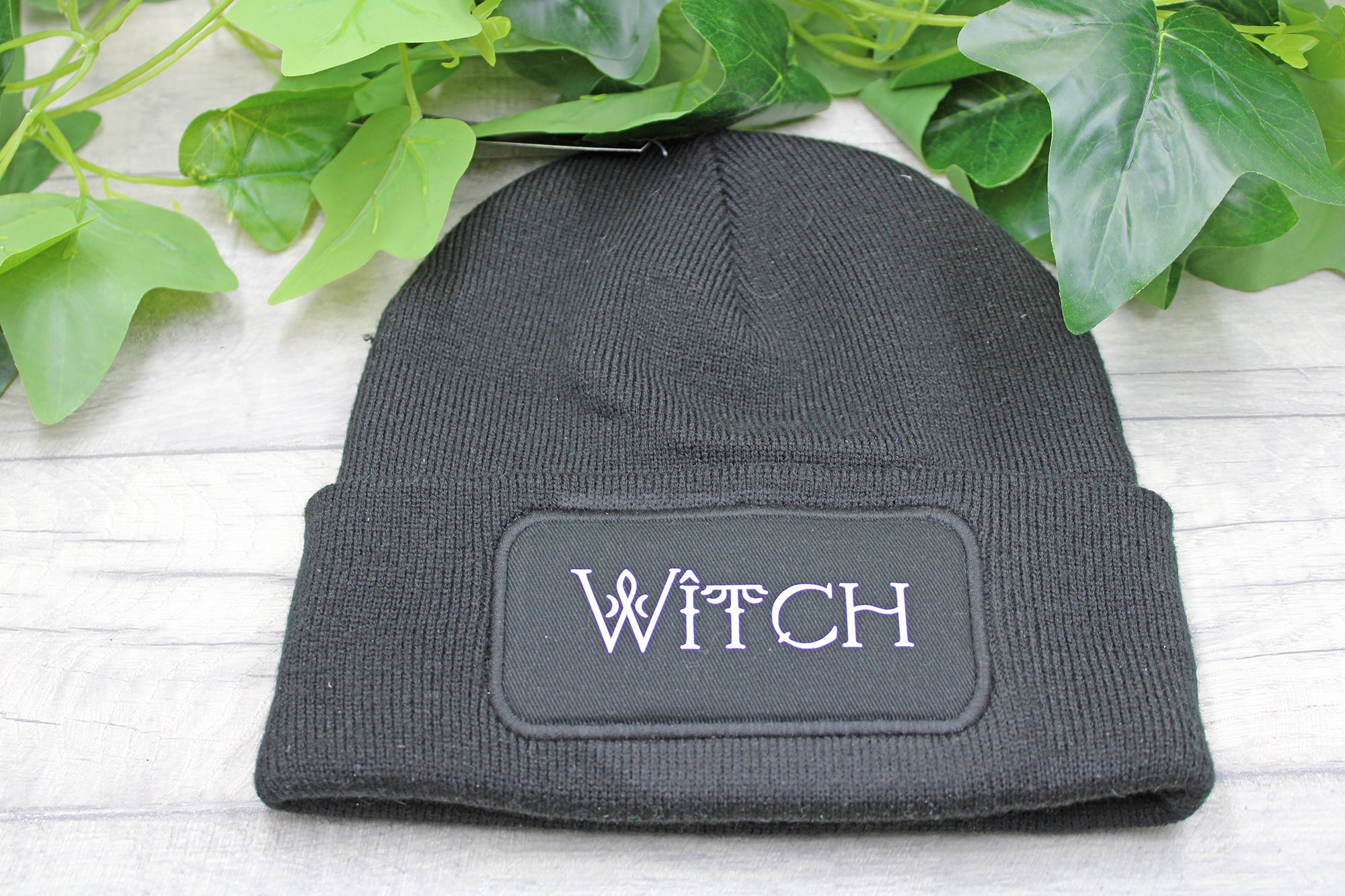 Black WITCH beanie hat with vinyl in white text on knit acrylic fabric