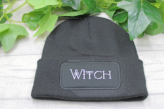 Black WITCH beanie hat with vinyl in white text on knit acrylic fabric