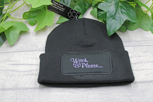 Flat lay of Witch Please beanie hat on rustic wood background