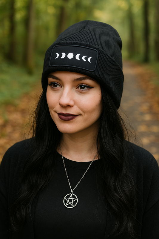 Model wearing moon phases beanie outdoors in autumn forest